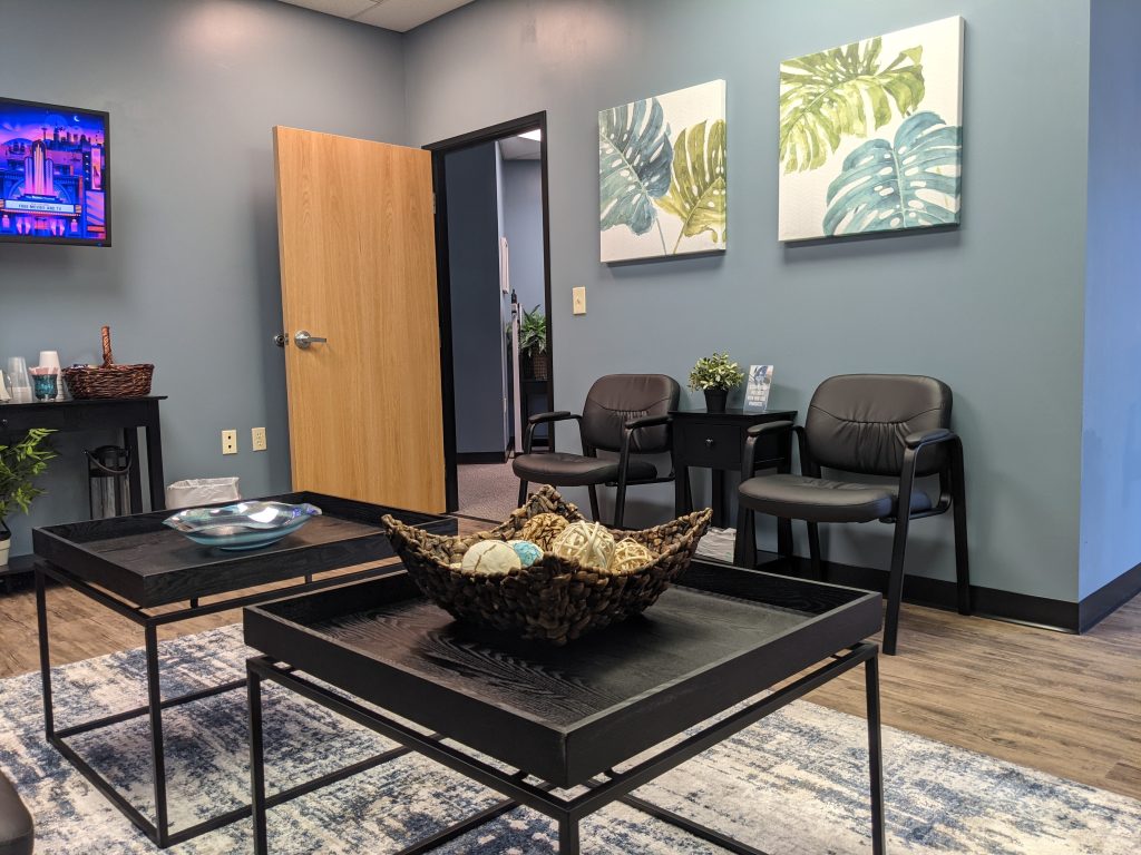 Modern ketamine clinic waiting area with comfortable seating and calming decor